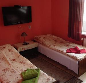 Cama ou camas em um quarto em Dom Sportowca Roko