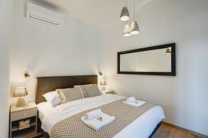 Łóżko lub łóżka w pokoju w obiekcie APARTMENTS NOVAK