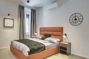 Łóżko lub łóżka w pokoju w obiekcie APARTMENTS NOVAK