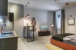 Łóżko lub łóżka w pokoju w obiekcie APARTMENTS NOVAK