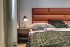 Łóżko lub łóżka w pokoju w obiekcie APARTMENTS NOVAK
