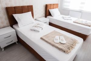 A bed or beds in a room at Araz Suit