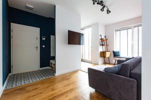 Televízia a/alebo spoločenská miestnosť v ubytovaní Gdańsk Comfort Apartament Rajska