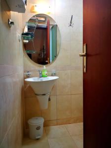 a bathroom with a sink and a mirror at St. Varvara Apartments in Ohrid