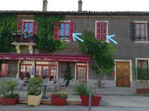 a restaurant with x signs on the side of a building at LA MAISON DE MARION in Tournus