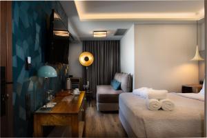 Postel nebo postele na pokoji v ubytování 360Degrees Pop Art Hotel