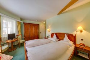 Postel nebo postele na pokoji v ubytování Hotel Berger Superior