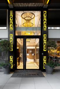 an entrance to a building with a large glass door at 360Degrees Pop Art Hotel in Athens