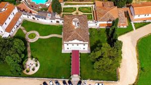 an overhead view of a house with a large roof at Villa Tolomei Hotel & Resort in Florence