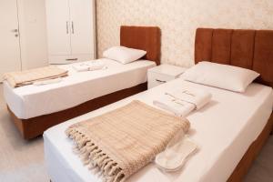 A bed or beds in a room at Araz Suit