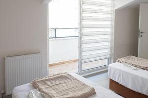 A bed or beds in a room at Araz Suit
