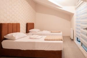 A bed or beds in a room at Araz Suit