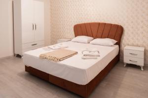 A bed or beds in a room at Araz Suit