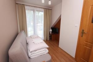 Postel nebo postele na pokoji v ubytování Gucio Domek Gościnny