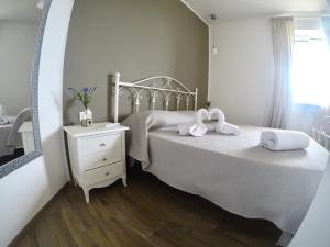 Postel nebo postele na pokoji v ubytování Don Peppe B&B