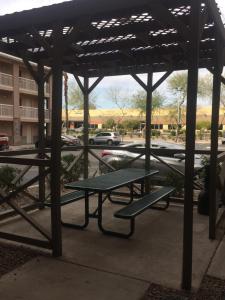 a picnic shelter with a picnic table in a parking lot at InTown Suites Extended Stay Phoenix AZ - West in Phoenix