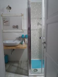 a bathroom with a sink and a shower at Sa Costera in Orosei +37 photos