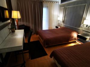 Postel nebo postele na pokoji v ubytování Hotel Electra