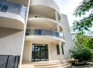 a modern house with a circular facade at Vila Kalliopi in Eforie Nord