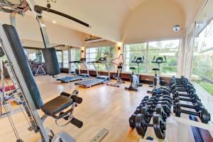 a gym with a lot of treadmills and weights at TUI MAGIC LIFE Penelope Beach - Families & Couples in Midoun