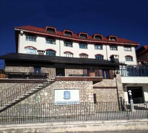 a building with a fence in front of it at Circolo Floridi in Guarcino