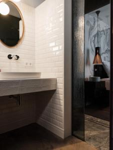 a bathroom with a sink and a mirror at Loft im Stadl in Innervillgraten