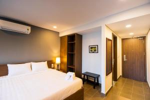 Katil atau katil-katil dalam bilik di BAYYA HOTEL PHU QUOC