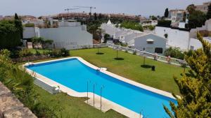 Bazén v ubytovaní Townhouse Mar y Sol alebo v jeho blízkosti