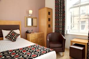 Posteľ alebo postele v izbe v ubytovaní Argyll Hotel
