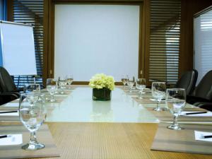 a long table with wine glasses on it at Astoria Plaza in Manila