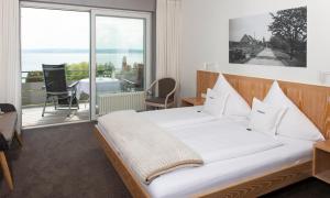 Postel nebo postele na pokoji v ubytování Hotel Freisicht