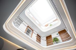 an overhead view of a building with a skylight at Plazuela del Carbón Suites in Cádiz