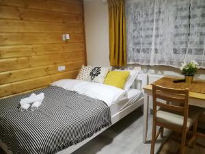 Posteľ alebo postele v izbe v ubytovaní Apartamenty Milka