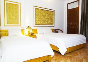 Giường trong phòng chung tại Hanoi Discovery Homestay