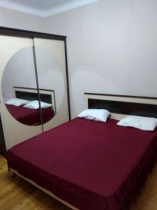 En eller flere senge i et værelse på Cozy House in Bina, Bolluq