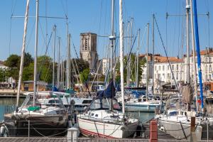 a group of boats docked in a marina at Tour de Nesle La Rochelle Vieux Port 3 etoiles in La Rochelle