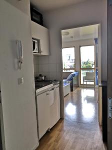 a kitchen with a sink and a stove at Studio lumineux 10 min à La Défense in Rueil-Malmaison +13 photos