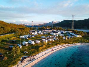 an aerial view of a campgrounds next to the water at Tjeldsundbrua Camping in Evenskjer