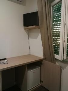 TV a/nebo společenská místnost v ubytování Borgo Marinaro Cetraro, Calabria