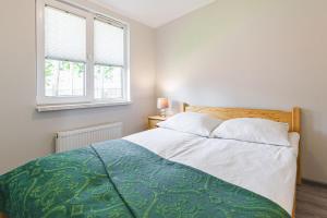 Posteľ alebo postele v izbe v ubytovaní Apartamenty Gromada Międzyzdroje