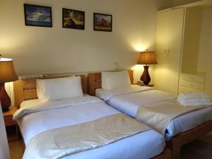 Een bed of bedden in een kamer bij Master's Hotel - Ehden