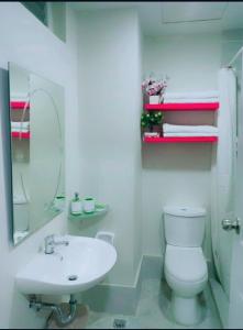 A bathroom at Amani Grand Residence near Mactan Cebu Intl Airport