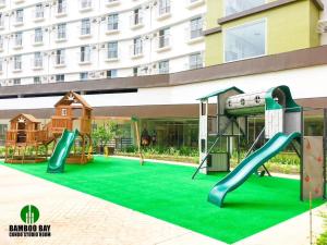 a play area with a slide and a playground at Fully Furnished Studio Unit in Mandaue City, Cebu with Fast WiFi and Cable TV in Cebu City