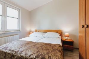 Posteľ alebo postele v izbe v ubytovaní Apartamenty Gromada Międzyzdroje