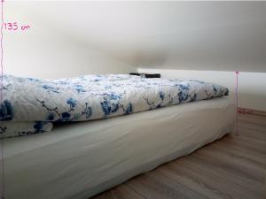 A bed or beds in a room at Vatnsás 10