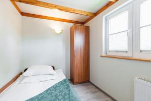 Posteľ alebo postele v izbe v ubytovaní Apartamenty Gromada Międzyzdroje