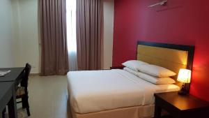 Postel nebo postele na pokoji v ubytování Puteri Bay Hotel + 33 fotografií