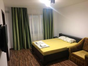Postel nebo postele na pokoji v ubytování Casa Bozianu