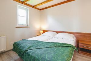 Posteľ alebo postele v izbe v ubytovaní Apartamenty Gromada Międzyzdroje