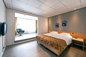 Postel nebo postele na pokoji v ubytování City Hotel Bergen op Zoom + 37 fotografií